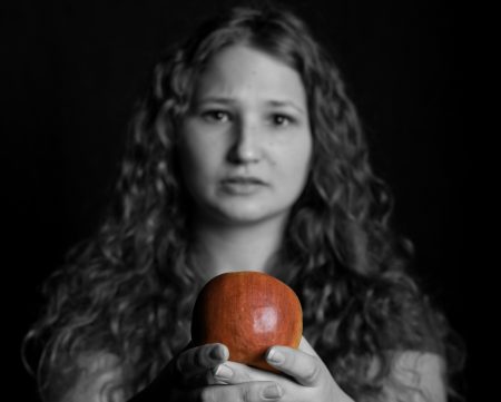 Jonas holds a red apple